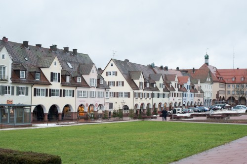 Arcaded buildings line the square