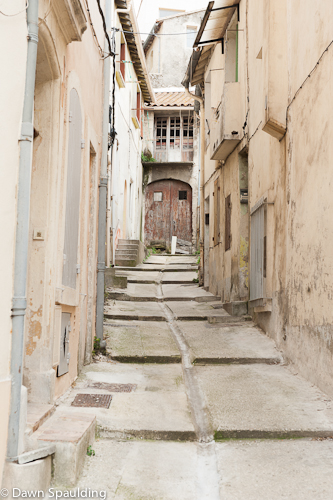 Narrow street amidst ancient buildings