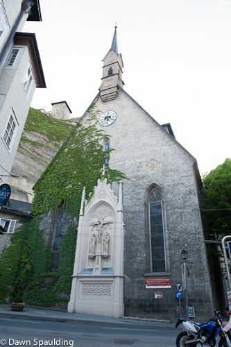 14th-century Kirche St. Blasius clings to the face of the Mönchsberg 